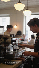 Barista preparing fresh espresso in cozy coffee shop