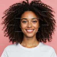 Confident Smiling Woman with Curly Hair in Studio Portrait