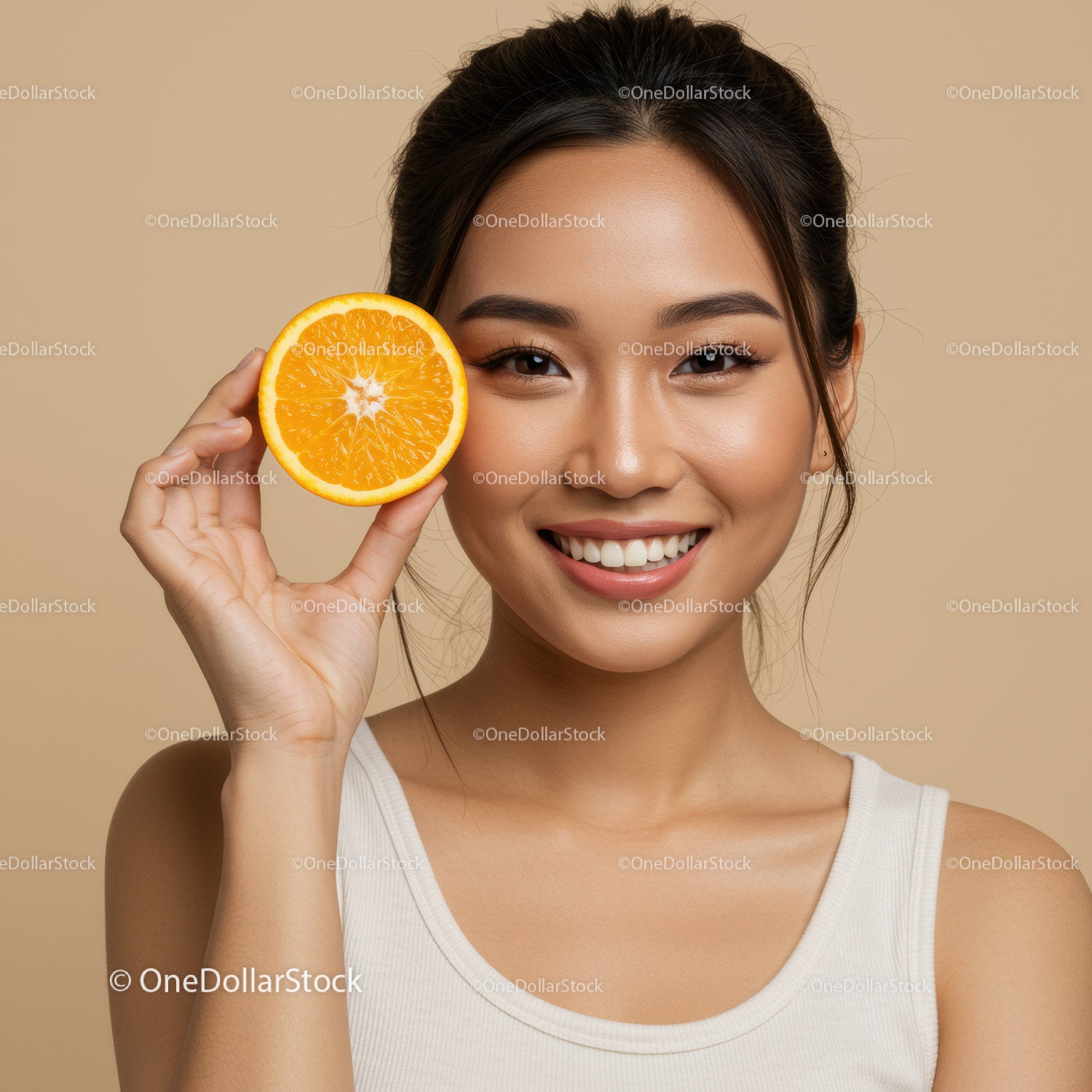 Smiling Woman Holding Orange Slice in Studio a Bright Natural Setting