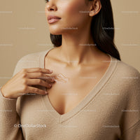 Close-Up of Woman Applying Cream to Collarbone for Healthy Skin