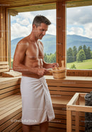 Relaxing Man Enjoying Sauna with Mountain View and Wooden Interior