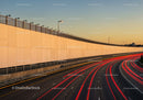 City Highway with Light Trails During Sunset in Urban Environment