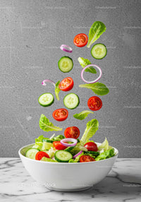 Fresh Vegetable Salad Ingredients Falling Into Bowl