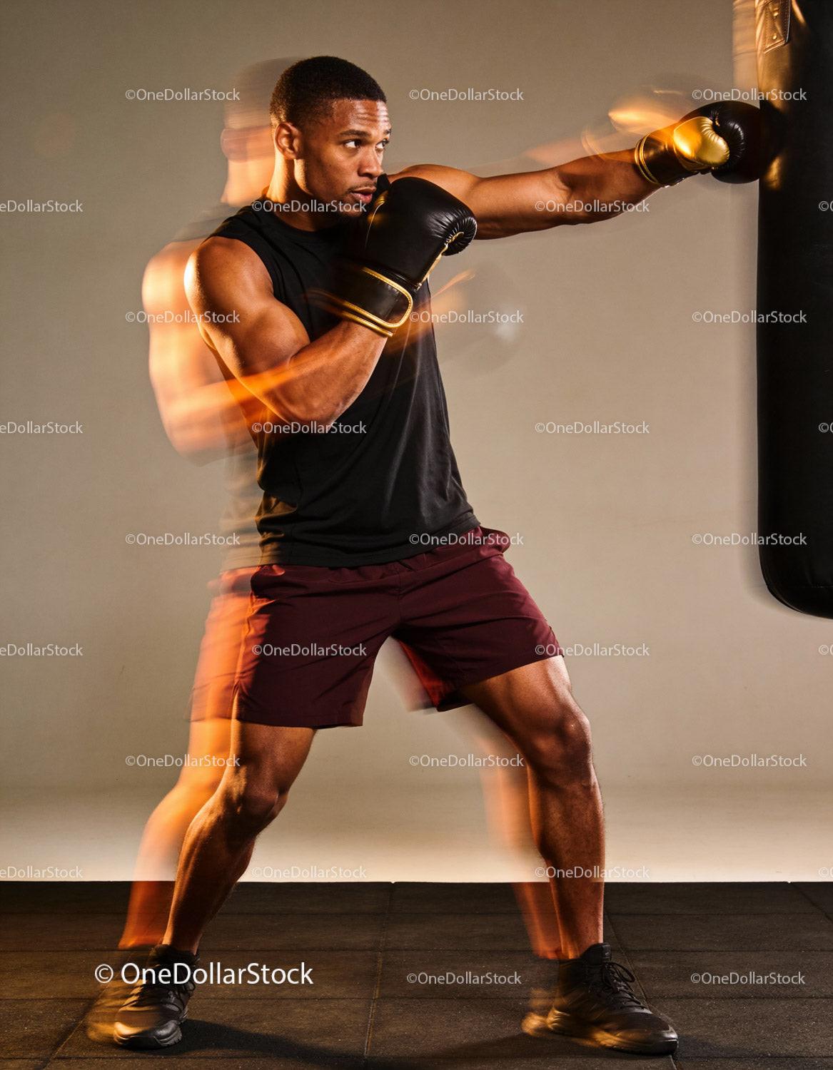 Focused boxer delivering a powerful punch during training