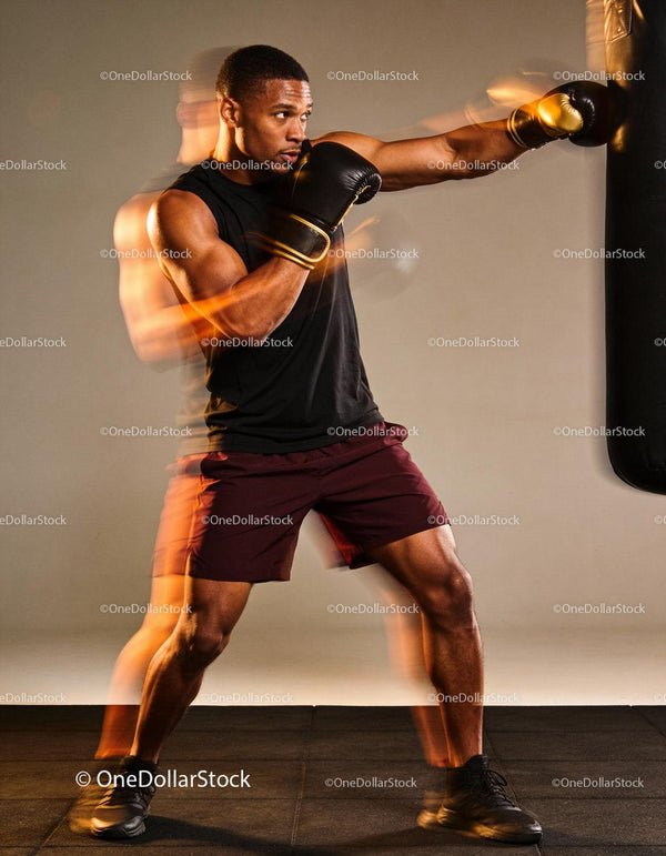 Focused boxer delivering a powerful punch during training