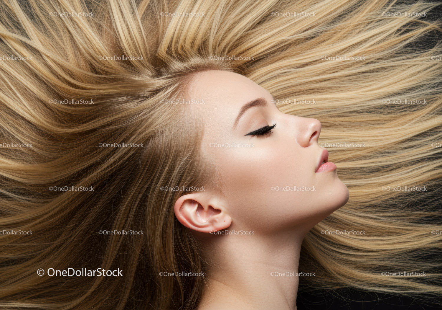Relaxed woman with flowing blonde hair and closed eyes