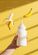 Baby Hand Holding Milk Bottle With Floating Bananas