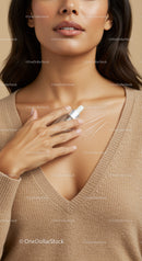 Close-up of Woman Applying Skincare Serum Highlighting Healthy Flawless Skin