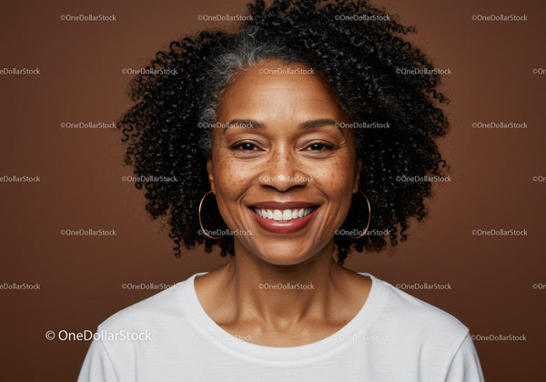 Confident Smiling Woman with Curly Hair in Casual White T-Shirt