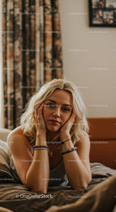 Young Woman Relaxing in Cozy Bedroom with Casual Style