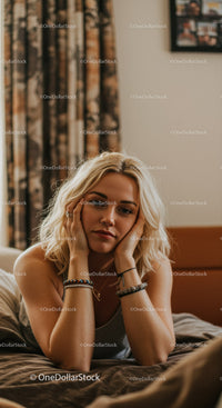 Young Woman Relaxing in Cozy Bedroom with Casual Style