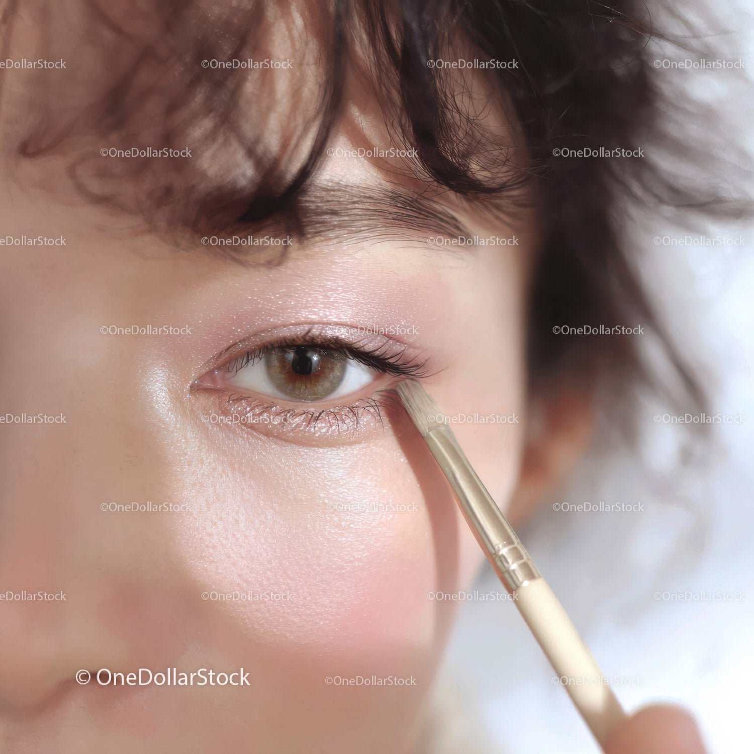 Close-Up of Woman Applying Eye Makeup with Brush in Professional Style