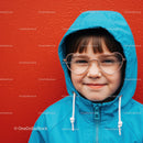 Smiling child in blue hooded jacket with heart glasses
