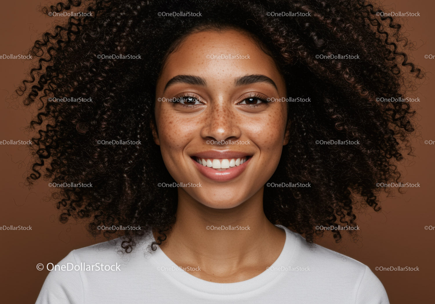 Portrait of a Smiling Woman with Curly Hair and Freckles in Casual Style