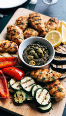 Grilled chicken with fresh vegetables and olive dip
