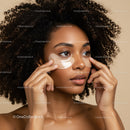 Elegant Woman Applying Under Eye Patches for Skin Rejuvenation