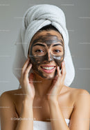 Smiling Woman with Facial Mask and Towel in Spa Setting