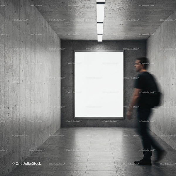 Man Passing by Blank Poster in Modern Concrete Hallway JPG Mockup Image