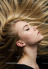 Profile of calm woman with flowing blonde hair