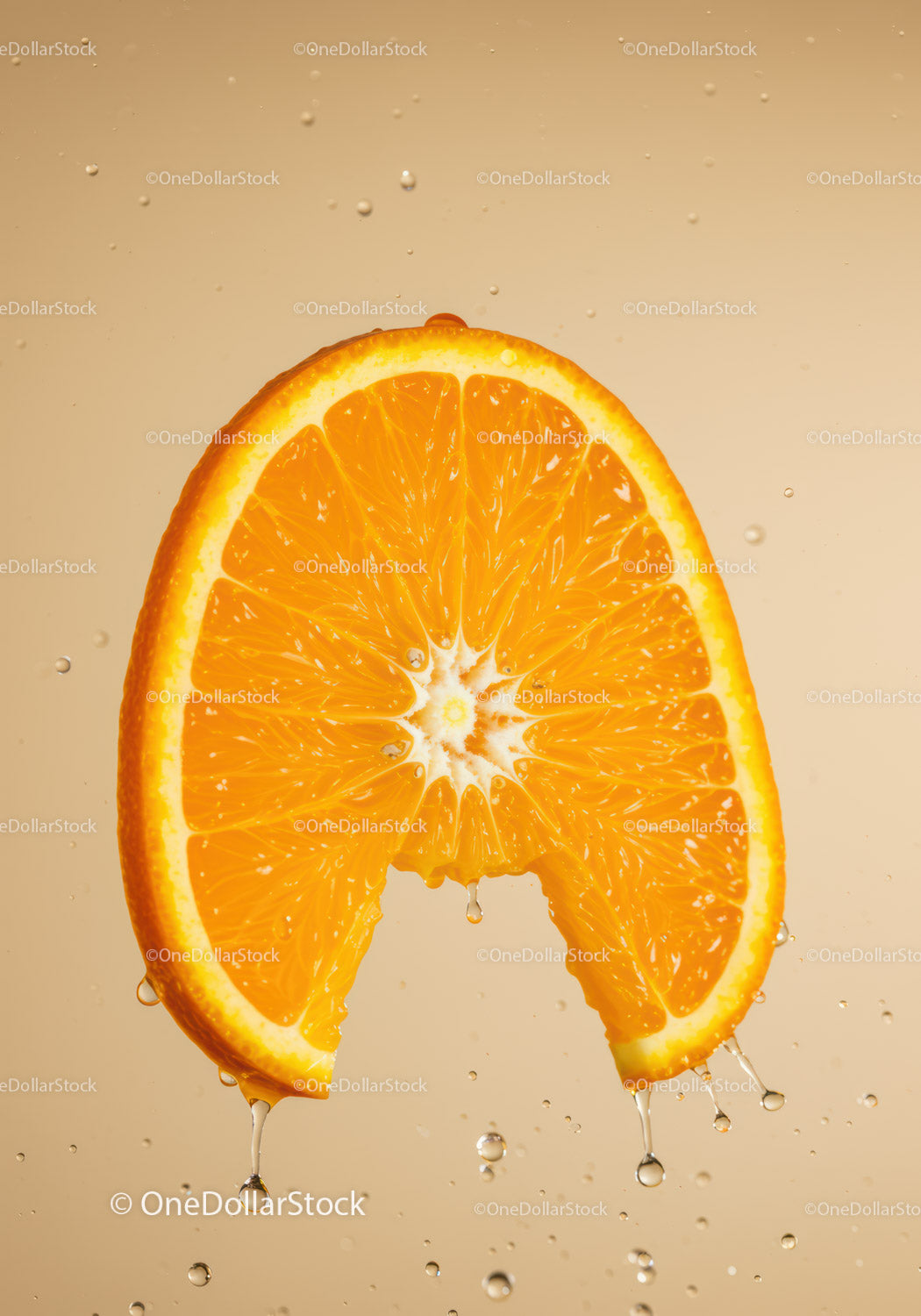 Fresh orange slice dripping juice on beige background