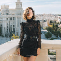 Elegant Woman in Black Lace Dress with City Skyline Background
