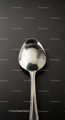 Classic silver spoon on a dark surface