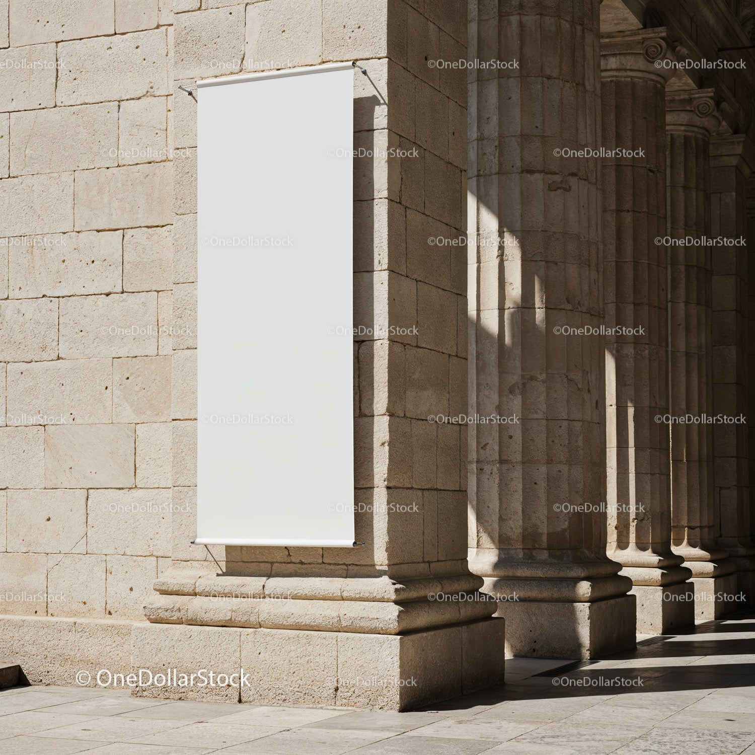 Blank vertical banner on stone building facade with columns