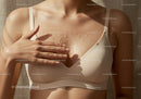 Close-up of a Woman Applying Oil to Her Skin for a Smooth Glow