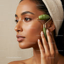Close Up of a Woman with a Jade Roller on Her Face for Skincare