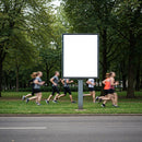 Group of Runners Passing Blank Outdoor Advertising Board