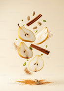 Floating pear slices with cinnamon and pistachios on beige