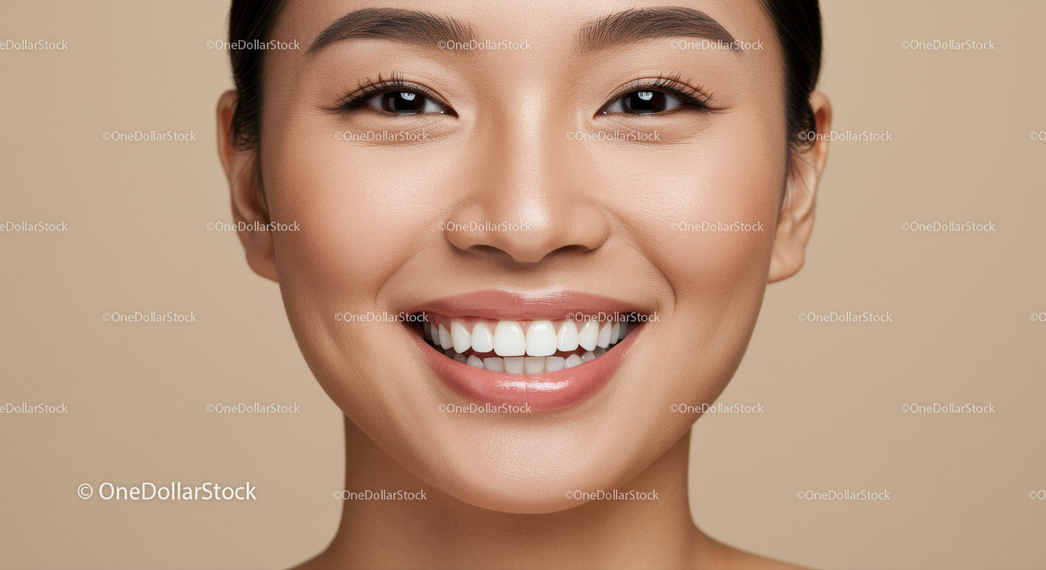 Close up of smiling woman with flawless glowing skin