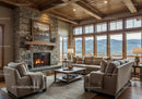 Cozy living room with stone fireplace and mountain view
