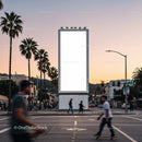 Urban street scene with blank billboard at sunset