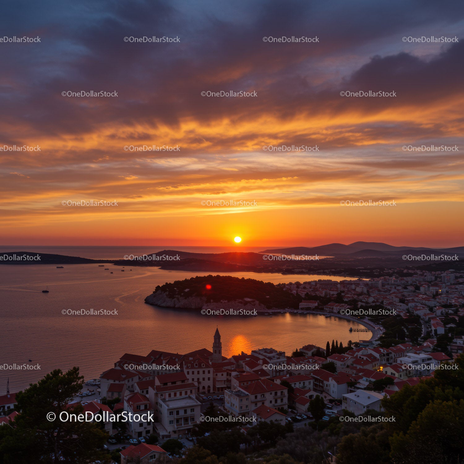 Scenic Sunset Over Coastal Town with Ocean and Mountain Views