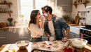 Couple Playfully Baking Heart-Shaped Cookies Together
