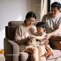 Family Enjoying Quiet Moment with Tabby Cat at Home