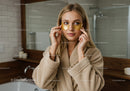 Woman Applying Eye Masks for Skin Care Relaxation