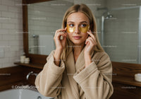 Woman Applying Eye Masks for Skin Care Relaxation