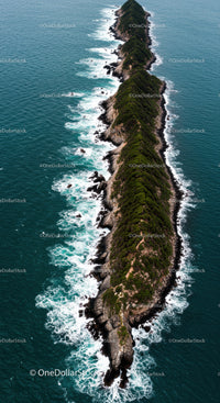 Remote Rocky Island with Green Vegetation and Turquoise Ocean
