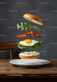 Deconstructed breakfast bagel with egg and greens