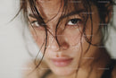 Close Up of a Woman with Wet Hair and Captivating Eyes