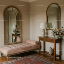 Cozy vintage hallway with pink bench and wooden console