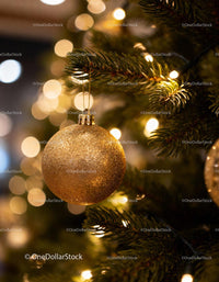 Golden Christmas Ornament Hanging on Festive Tree