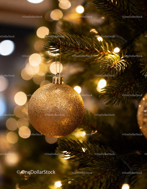 Golden Christmas Ornament Hanging on Festive Tree