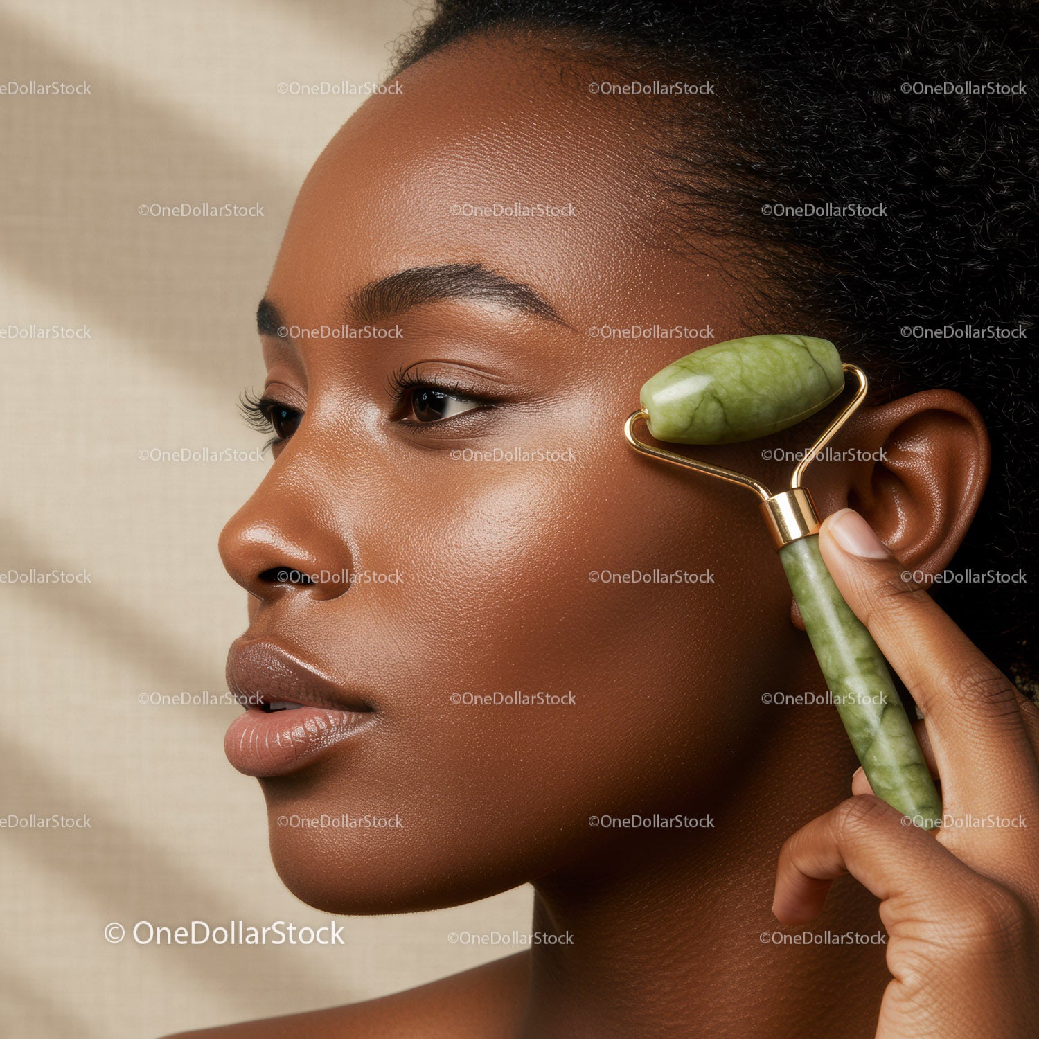 Close-up of a Woman Using Jade Roller for Facial Massage and Skin Care