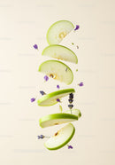 Floating green apple slices with lavender flowers