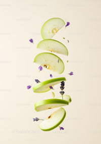 Floating green apple slices with lavender flowers