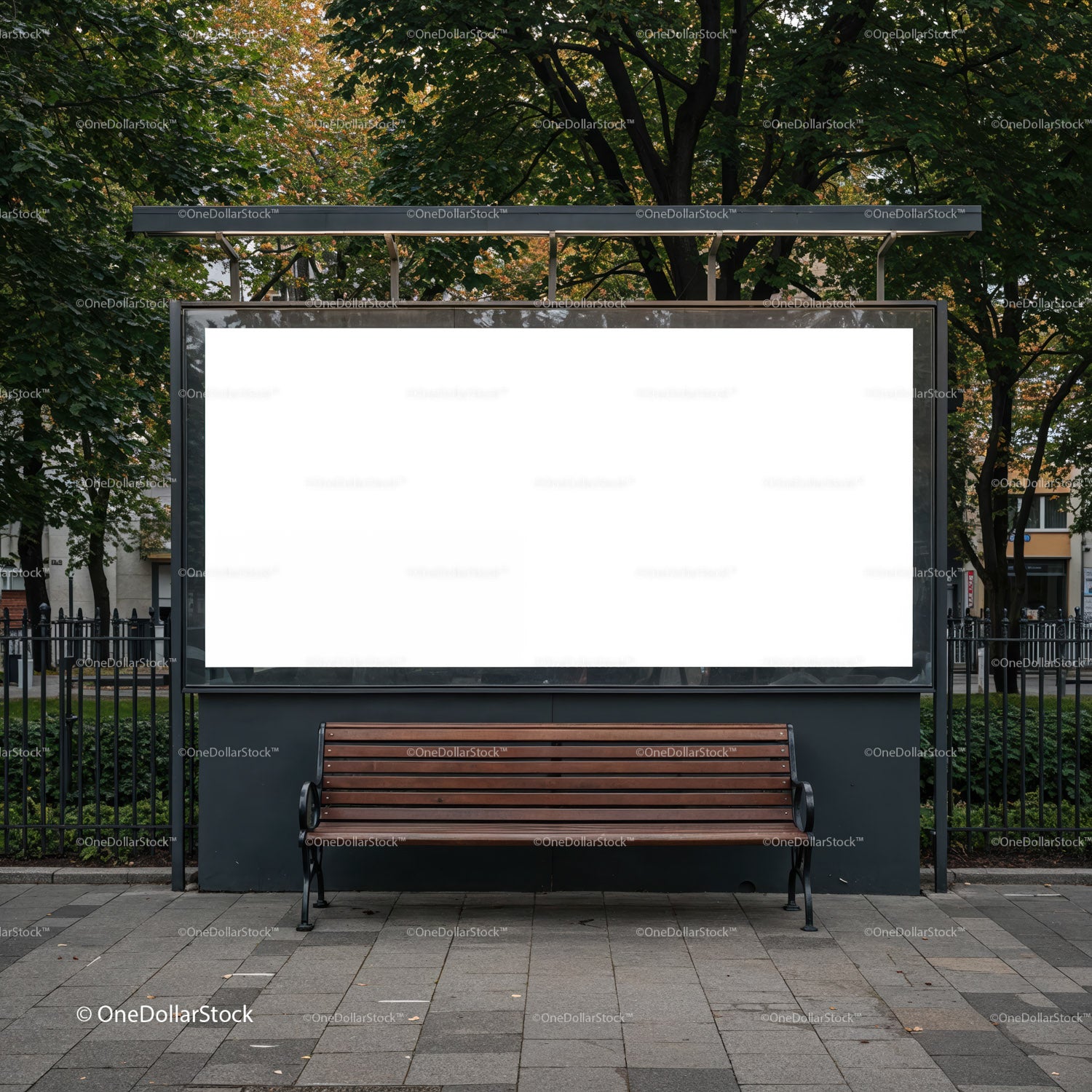 Empty urban bench under large blank billboard in park