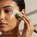 Woman Using Jade Roller for Facial Massage and Skin Refreshment